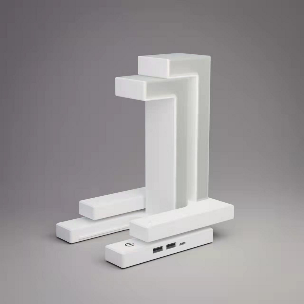 Modern white lamp with USB ports on a gray background